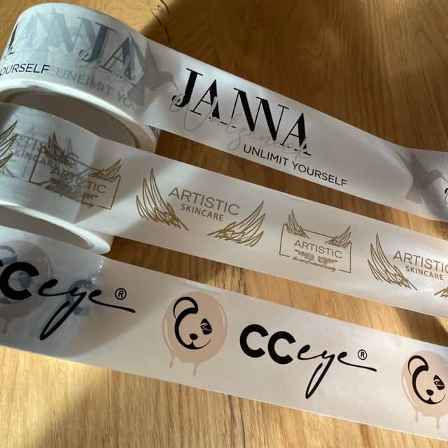 Adhesive tape / parcel tape / printed with logo / PVC / gold - silver / 36 rolls